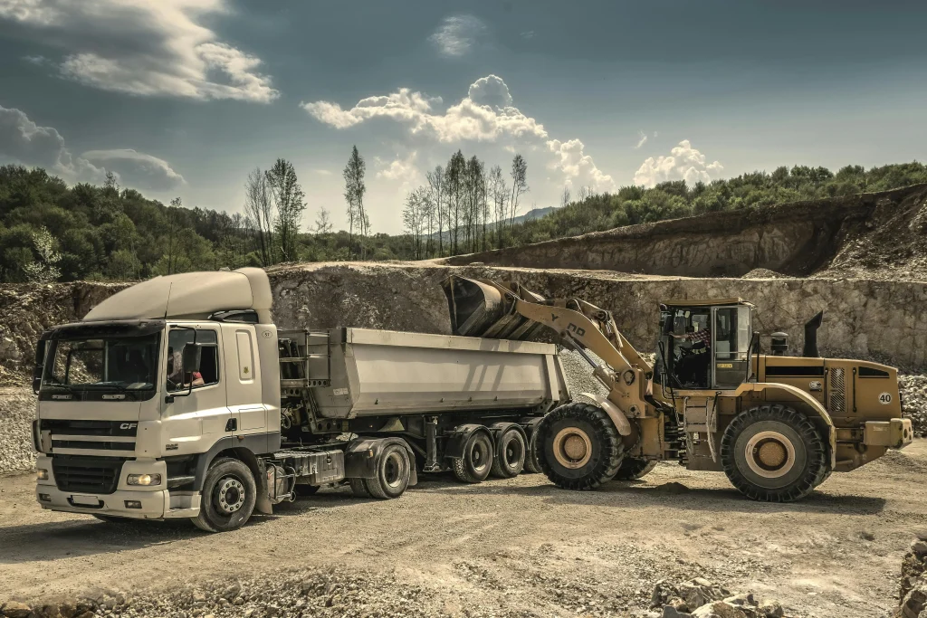 A bulldozer and transport vehicle.
